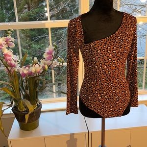 NWT - Never worn body suit with an asymmetrical neck line